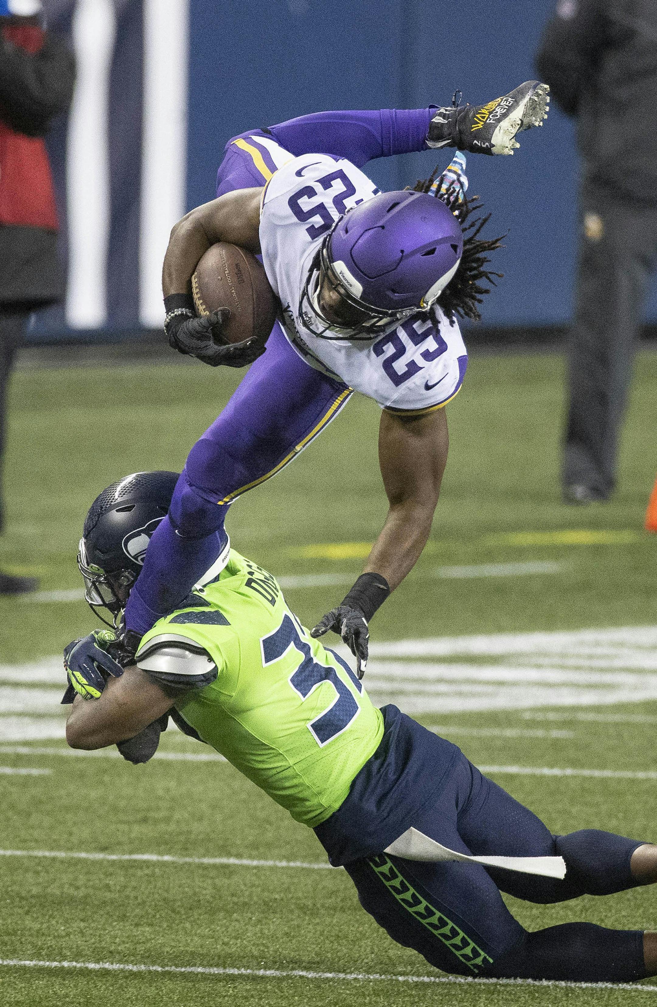 Quandre Diggs makes te open field tackle of Minnesota running back Alexander Mattison in the 3rd quarter. The Minnesota Vikings played the Seattle Seahawks in NFL Football Sunday, October 11, 2020 at CenturyLink Field in Seattle, WA. (Dean Rutz/Seattle Times/TNS)