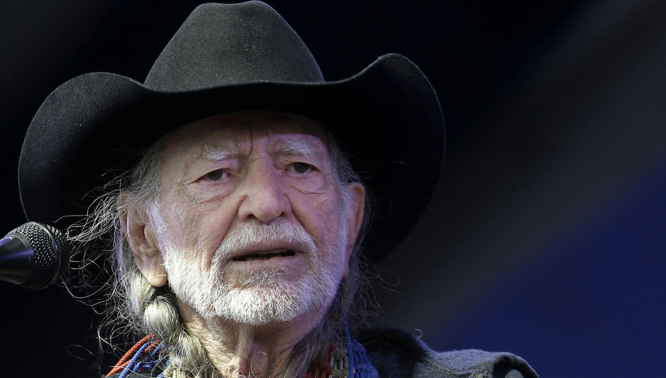FILE - This May 3, 2013 file photo shows Willie Nelson performing at the New Orleans Jazz and Heritage Festival in New Orleans. The Pilgrimage Music & Cultural Festival will launch this September, 2015 with a lineup that includes Nelson, Weezer, Sheryl Crow, Neko Case, Iron & Wine and Jimmy Cliff, among others. It will be held in Franklin, Tenn.e, just outside Nashville. Organizers said Tuesday, April 21, 2015 that many of the acts will be performing acoustically and will do so on wood-clad stag