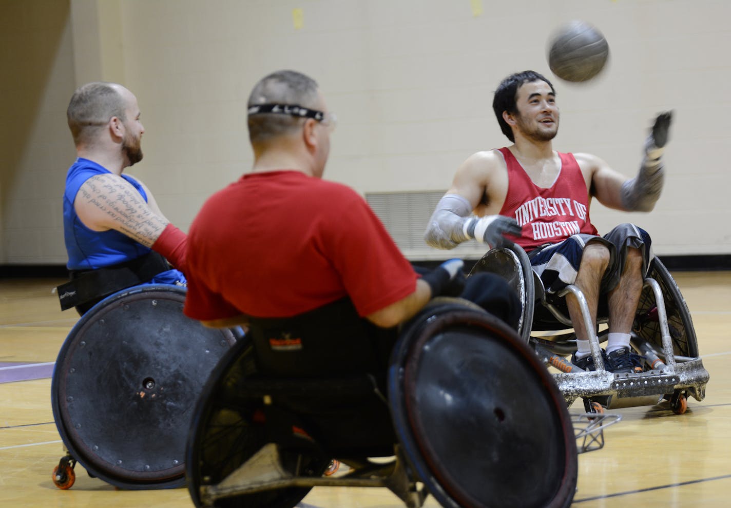 (left to right) Tom Cloyd (of Minneapolis), Ken Walsh (of Shoreview) and Chuck Aoki (of Minneapolis) huddle up prior to taking on their fellow Minnesota Steelheads teammates in a practice game. Photo by Liz Rolfsmeier, Special to the Star Tribune