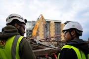 Henry Cacique, right, is given a tour of a construction site by Mortenson field engineer Jordan Schenck at on the Abbott Northwestern campus by on his