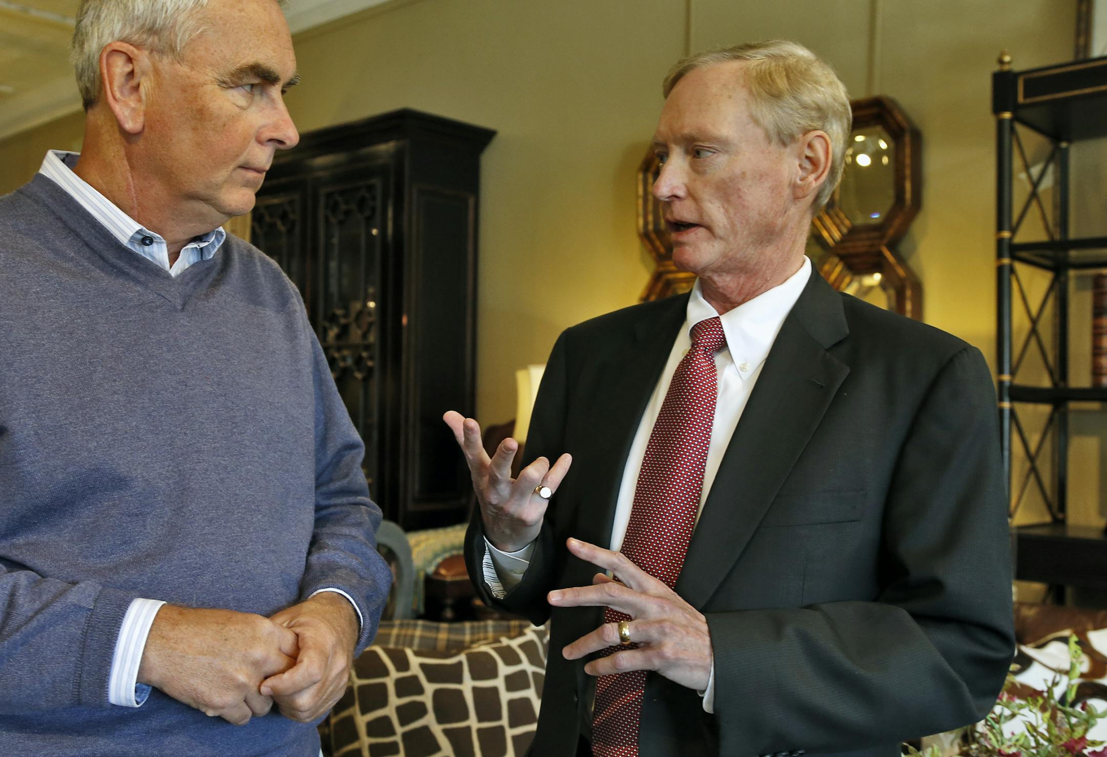 Minneapolis antitrust attorney K. Craig Wildfang, right, talked with original plaintiff Michael Schumann in Schumann&#x2019;s St. Paul furniture store.