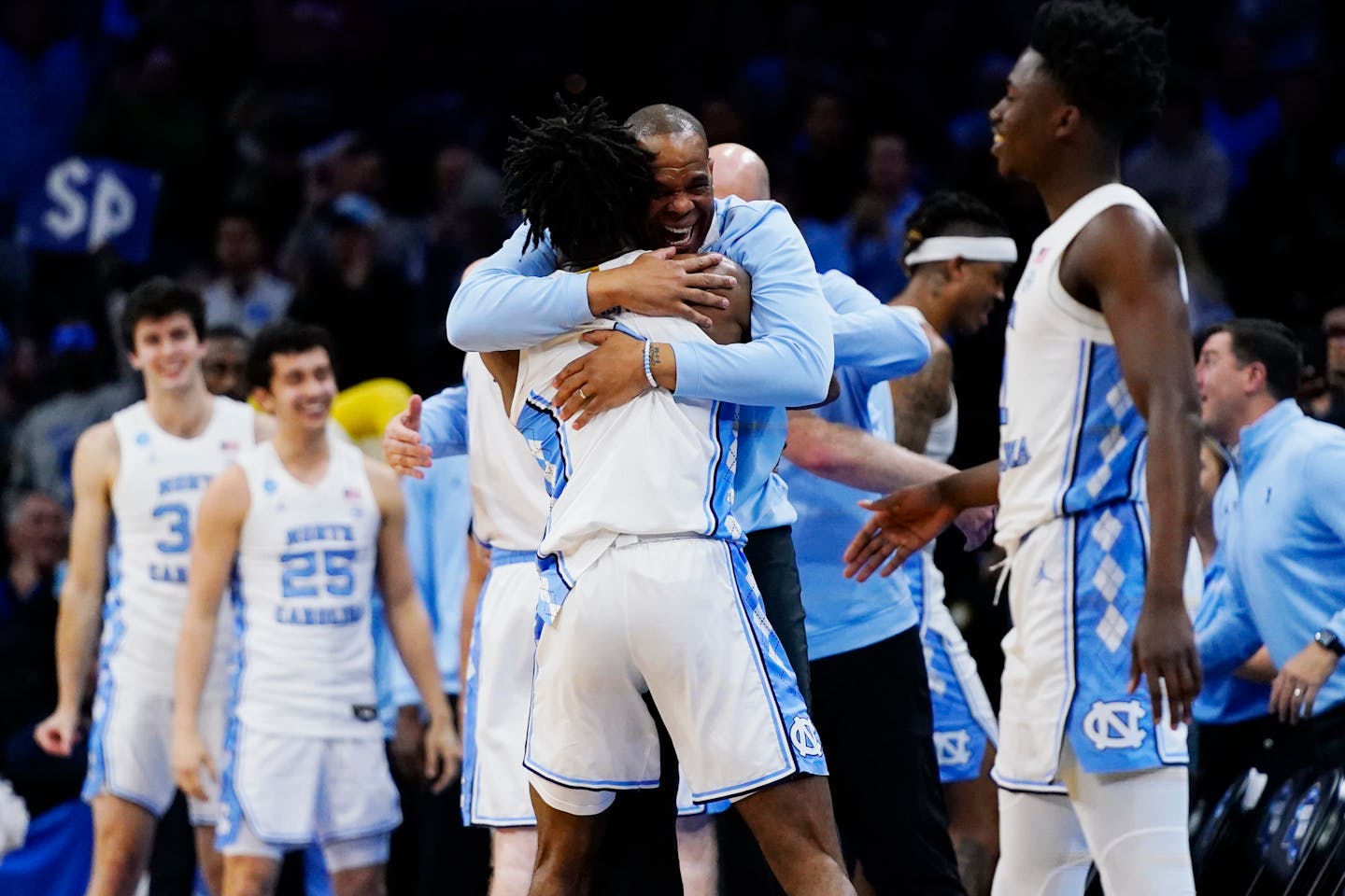 North Carolina's Hubert Davis, right, and Leaky Black celebrate after a college basketball game against St. Peter's in the Elite 8 round of the NCAA tournament, Sunday, March 27, 2022, in Philadelphia. (AP Photo/Chris Szagola)