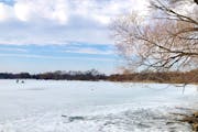 Two ice fishers took to Lake Hiawatha on Saturday, despite temperatures in the 50s and open water on the other side of the Minneapolis lake.