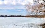 Two ice fishers took to Lake Hiawatha on Saturday, despite temperatures in the 50s and open water on the other side of the Minneapolis lake.