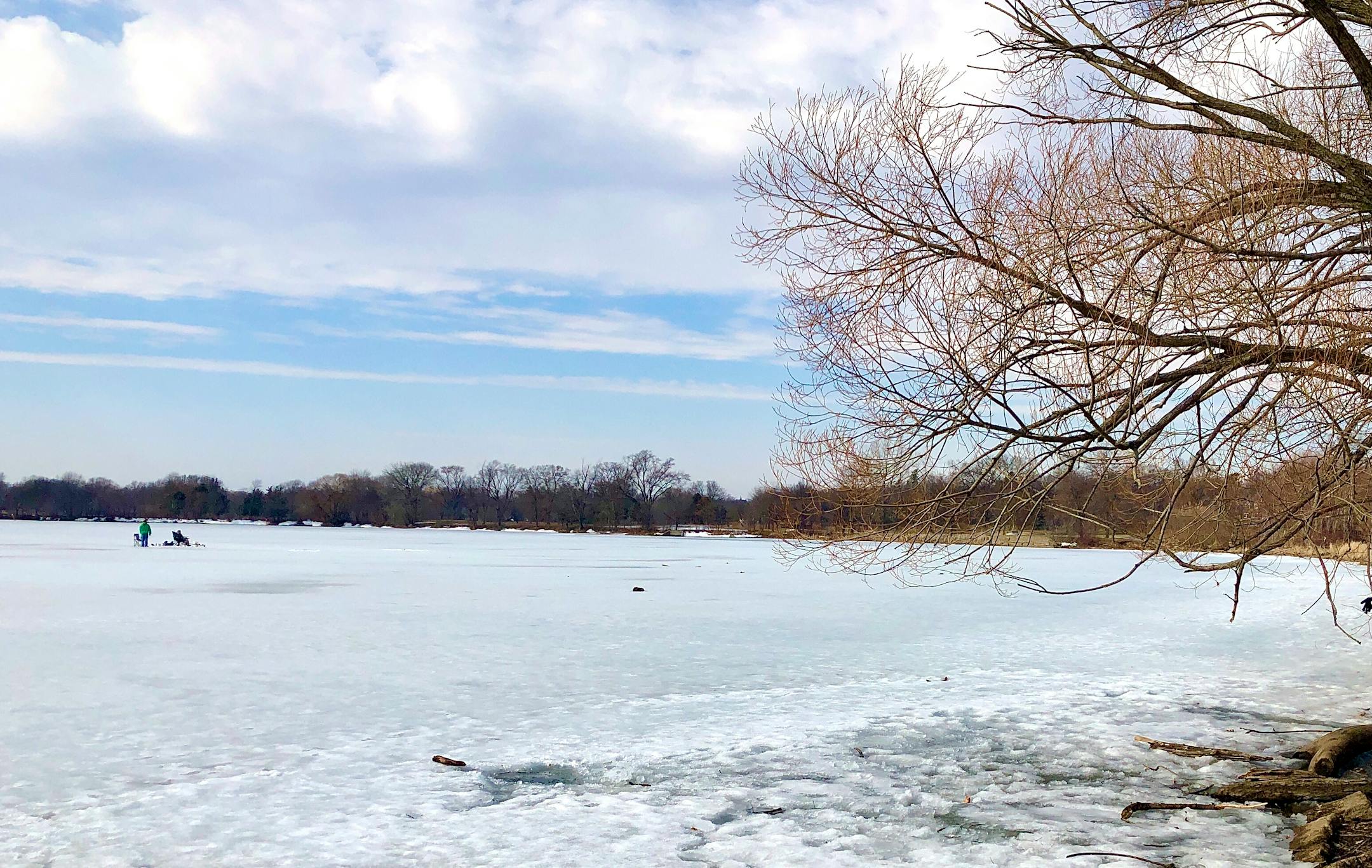 Two ice fishers took to Lake Hiawatha on Saturday, despite temperatures in the 50s and open water on the other side of the Minneapolis lake.