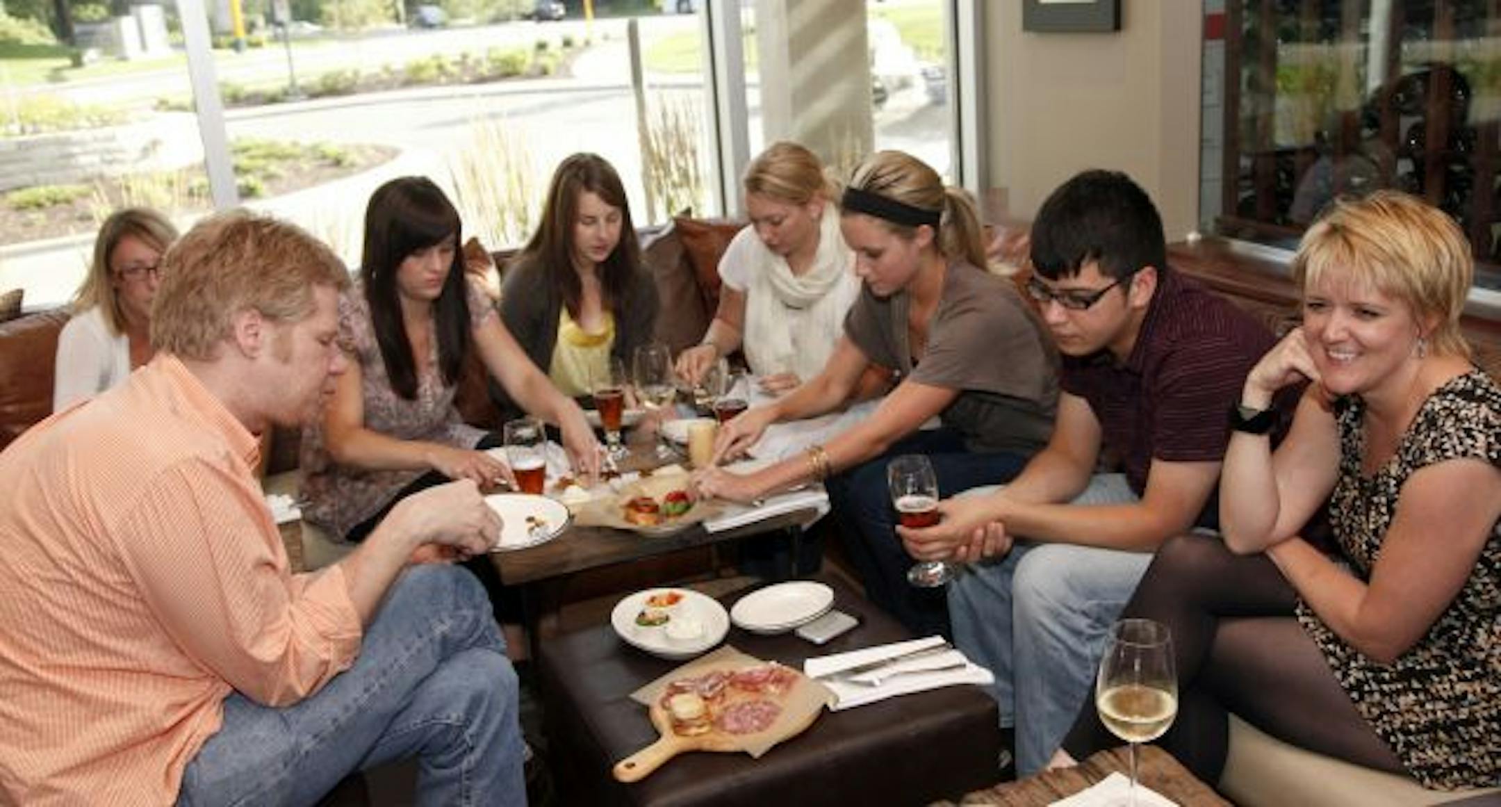 A group gathered for happy hour at Parma 8200.