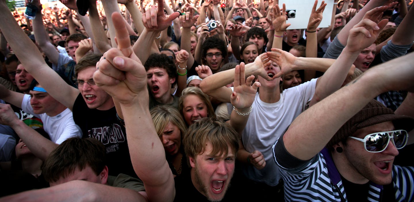 JERRY HOLT&#xef;jgholt@startribune.com 5/25/2008----]Nick Alexander left of Minneapolis and Josh Stine of Indianapolis Indiana enjoyed the music of Hip Hop artist Brother Ali Sunday at Soundset festival Sunday at the metro dome parking lot. The show was sponsored by local rap label Rhymesayers.