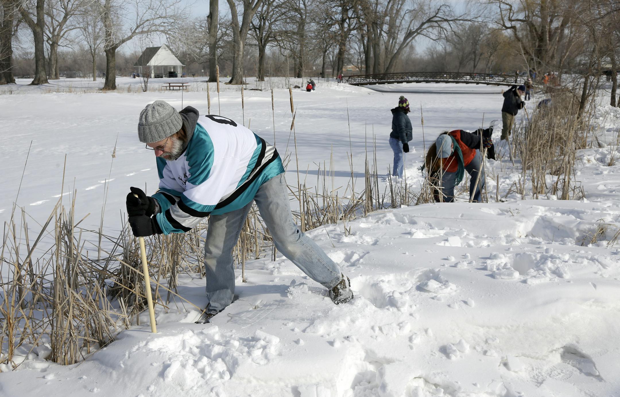 Bret Running and Natasha Jenson searched the lakes edge along with about 75 other volunteers who came to the call of Kira Trevino's family to search the Keller Lake area, Maplewood, MN., Saturday morning. The search was one of five conducted on March 23rd after items determined to be connected to Kira, through DNA tests, were found in the area last week . [ TOM WALLACE/STAR TRIBUNE Assignments #20028251B March 23, 2013 SLUG TREVINO0324 EXTRA INFORMATION Thirty-year-old Kira Trevino has been miss