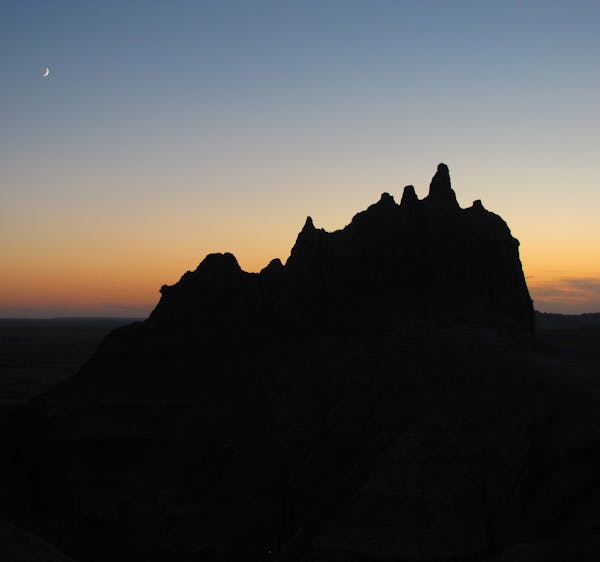 Dusk brings out a different kind of beauty in South Dakota's Badlands.