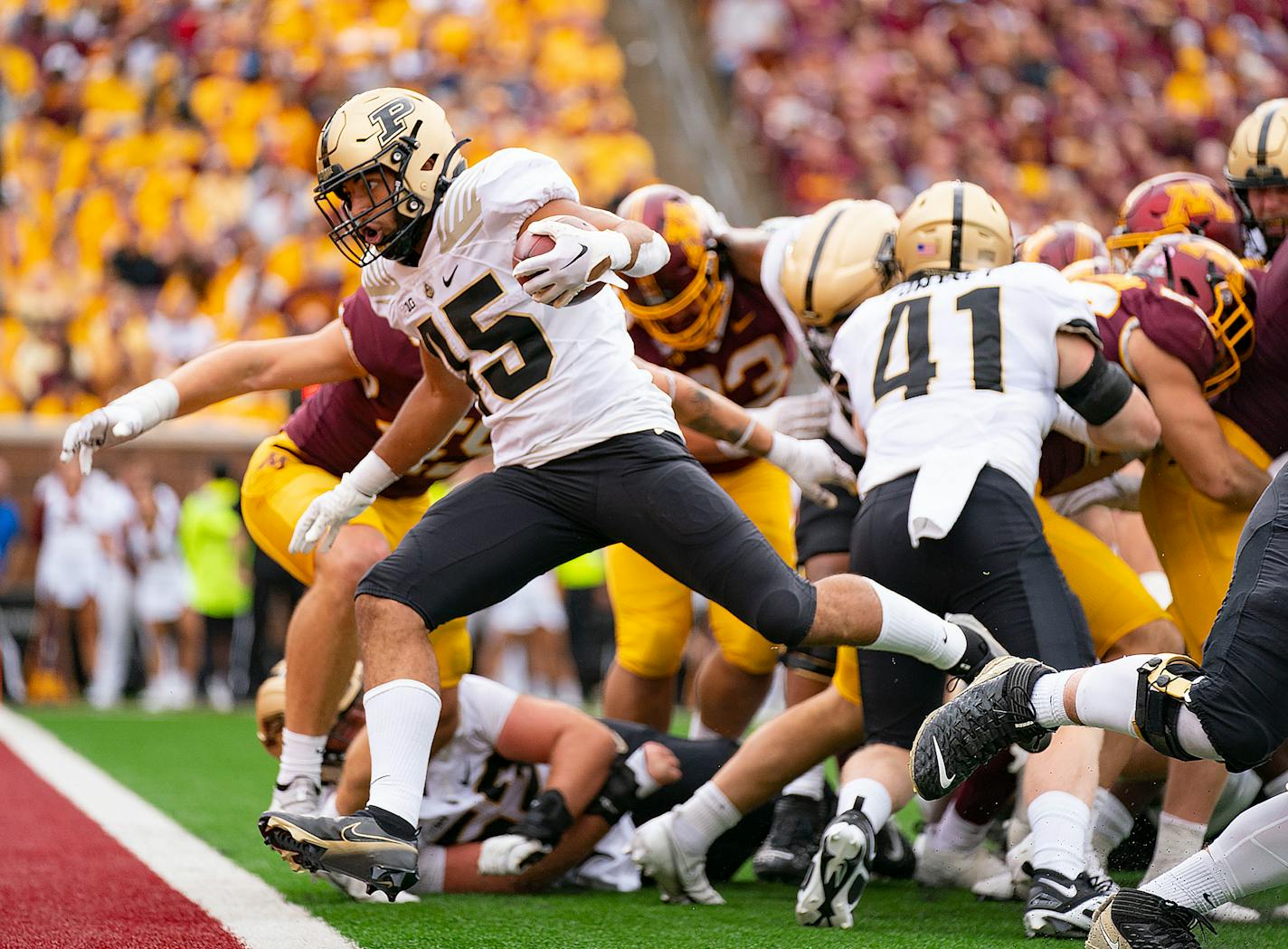 Purdue Boilermakers running back Devin Mockobee (45) scores a rushing touchdown against the Minnesota Gophers to put his team up by ten points in the fourth quarter Saturday, Oct. 1, 2022 at Huntington Bank Stadium in Minneapolis, Minn. ]