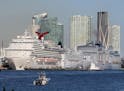 Cruise ships line up along Port Miami of Miami as cruises have been canceled due to the coronavirus COVID-19 pandemic on Sunday, March 15, 2020 in Mia