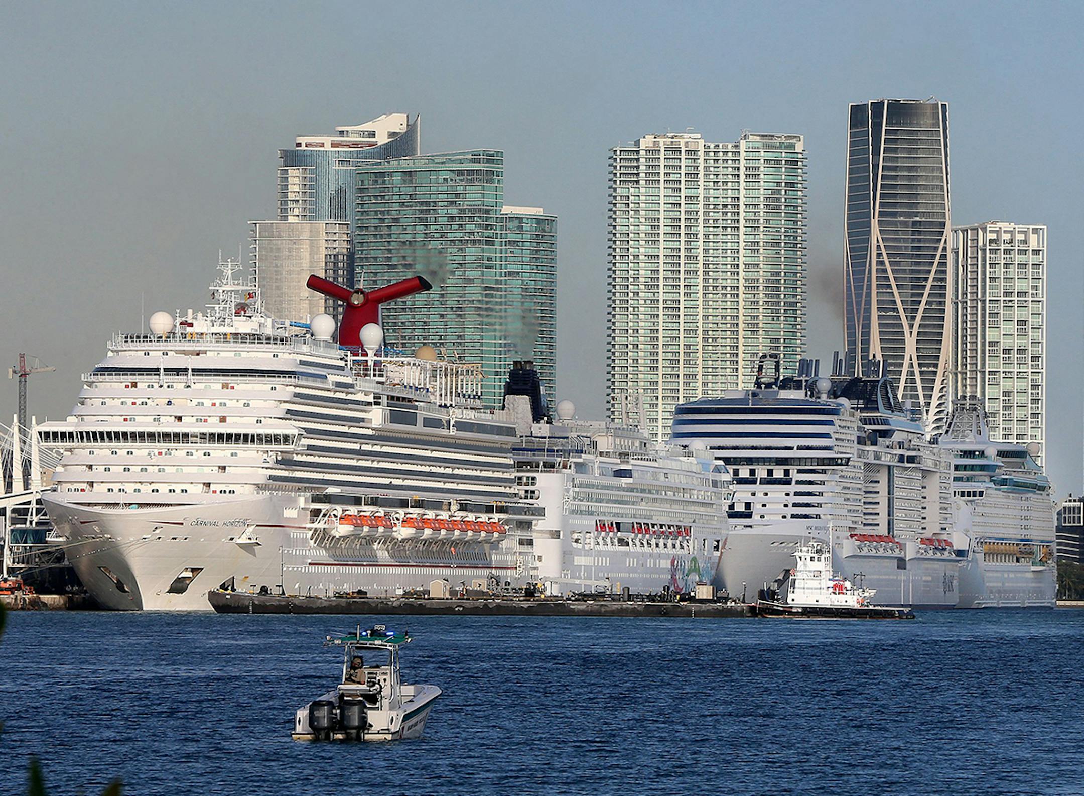 Cruise ships line up along Port Miami of Miami as cruises have been canceled due to the coronavirus COVID-19 pandemic on Sunday, March 15, 2020 in Miami, Fla. (Pedro Portal/Miami Herald/TNS) ORG XMIT: 1734767