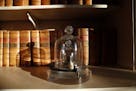 In this photo taken Wednesday, Oct. 17, 2018., a replica of the International Prototype Kilogram is pictured under glass at the International Bureau o
