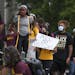 Gophers student athletes rallied outside Morrill Hall to protest against plans to cut four men's sports from the school's athletic program.