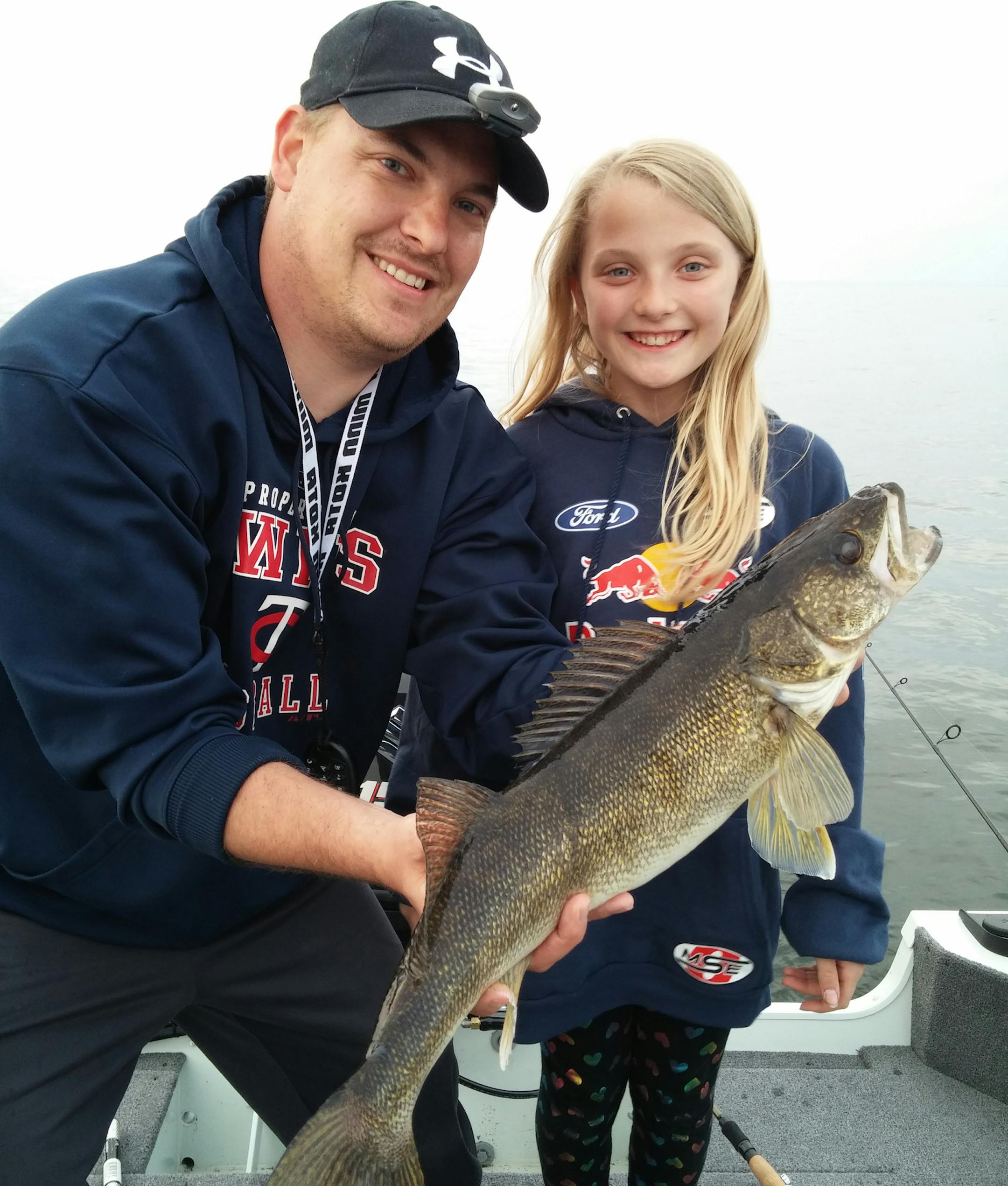 Brenna Wessman, 10, of Otsego, with a walleye she caught on Lake Mille Lacs with her uncle, TJ Lorenzen of Brooklyn Park.