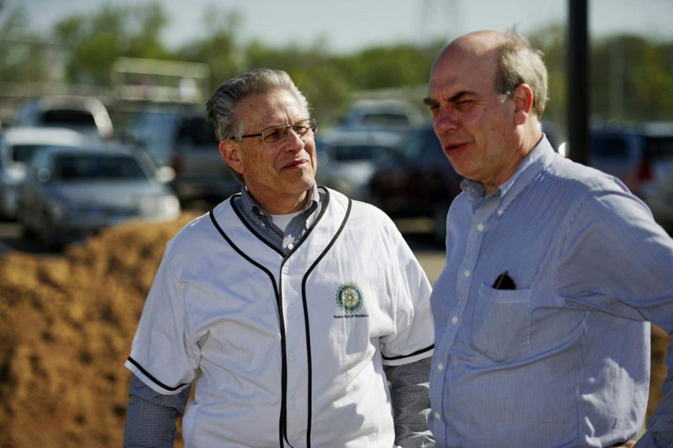At the Bielenberg Sports Center in Woodbury, Alan Henaman and Cork Wicker, both from the Woodbury Rotary Club, talked as they looked over the plot of land where their club hopes to construct a Miracle League Field. This field would provide opportunities for kids with mental or physical disabilities to play baseball.