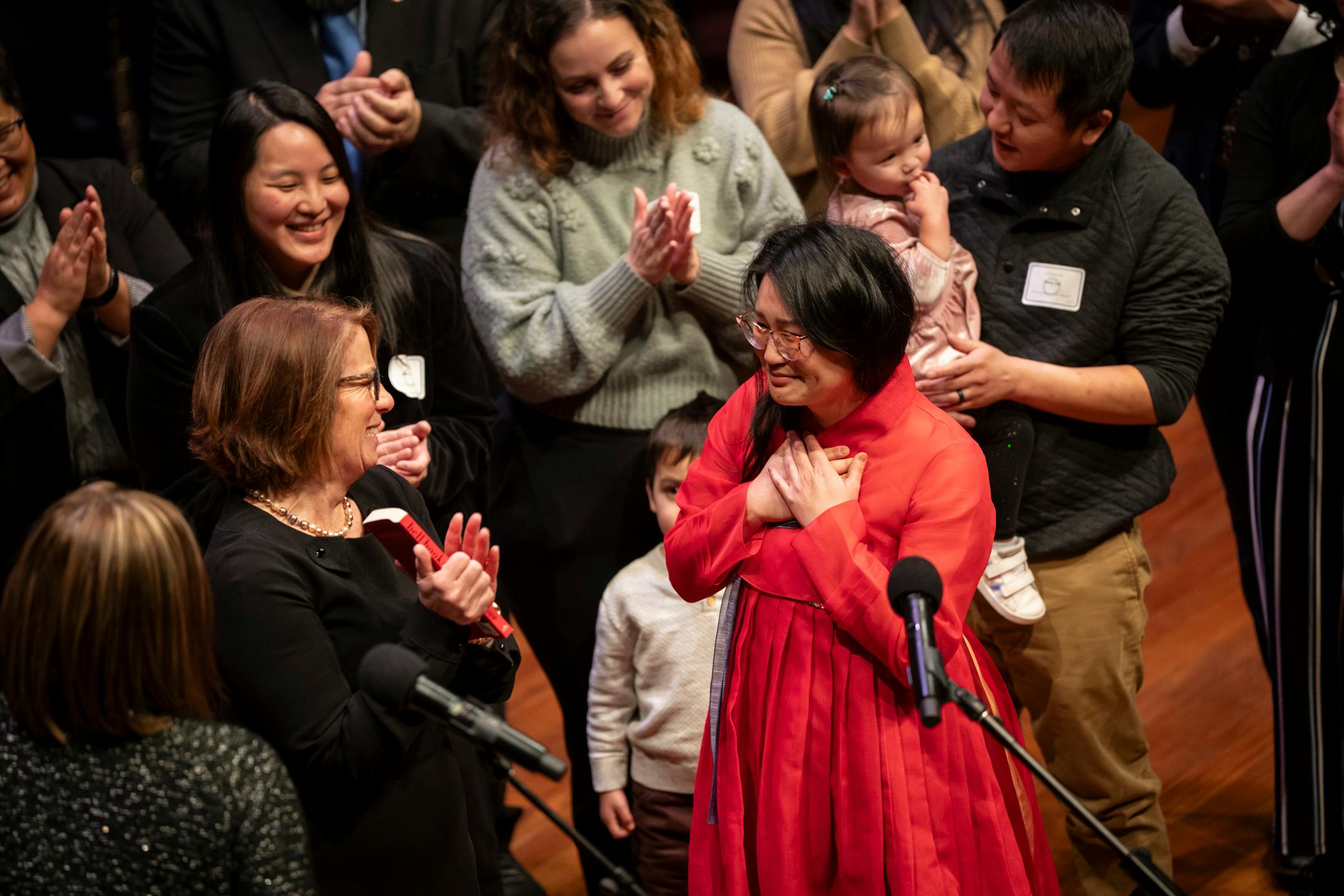 New Council Member HwaJeong Kim, Ward 5, reacts with gratitude after she is sworn in next to her loved ones at the swearing in ceremony of the seven female St. Paul city council members, four new to the council, at the Ordway Center on Tuesday, Jan. 9, 2024 in St. Paul, Minn. ] RENEE JONES SCHNEIDER • renee.jones@startribune.com