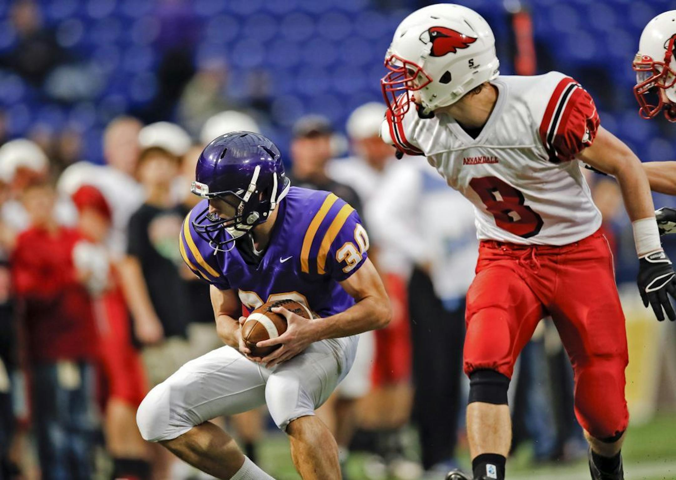 Rochester Lourdes' Kane Carstens (30) picks off a first half pass intended for Annandale's Matt Miller during action Saturday, Nov. 17, 2012, at the Metrodome in Minneapolis, MN.