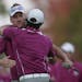 Europe's Ian Poulter hugs Rory McIlroy after winning their four-ball match at the Ryder Cup PGA golf tournament Saturday, Sept. 29, 2012, at the Medin
