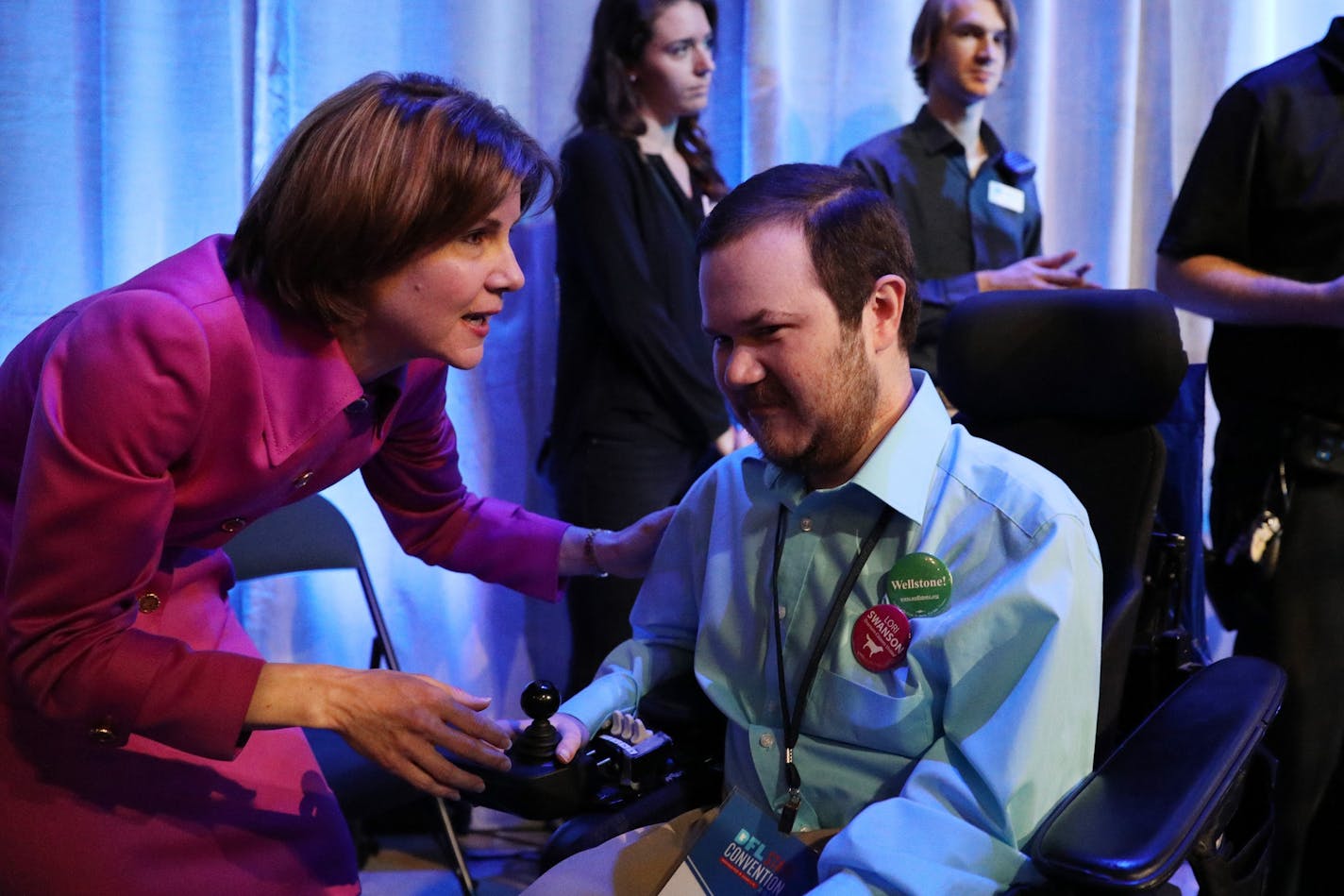 Minnesota Attorney General Lori Swanson talked with supporter Jacob Gunvalson after he endorsed her from the stage at the DFL state convention on June 2.