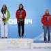 Women's downhill medalists, from left, Slovenia's Tina Maze and Switzerland's Dominique Gisin, who tied for the gold, and Switzerland's Lara Gut, who 