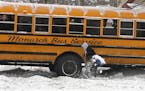 JIM GEHRZ &#xef; james.gehrz@startribune.com St. Paul/February 26, 2009/4:00PM Andrew Miller, 23, stopped to help dig a school bus out of the snow Thu