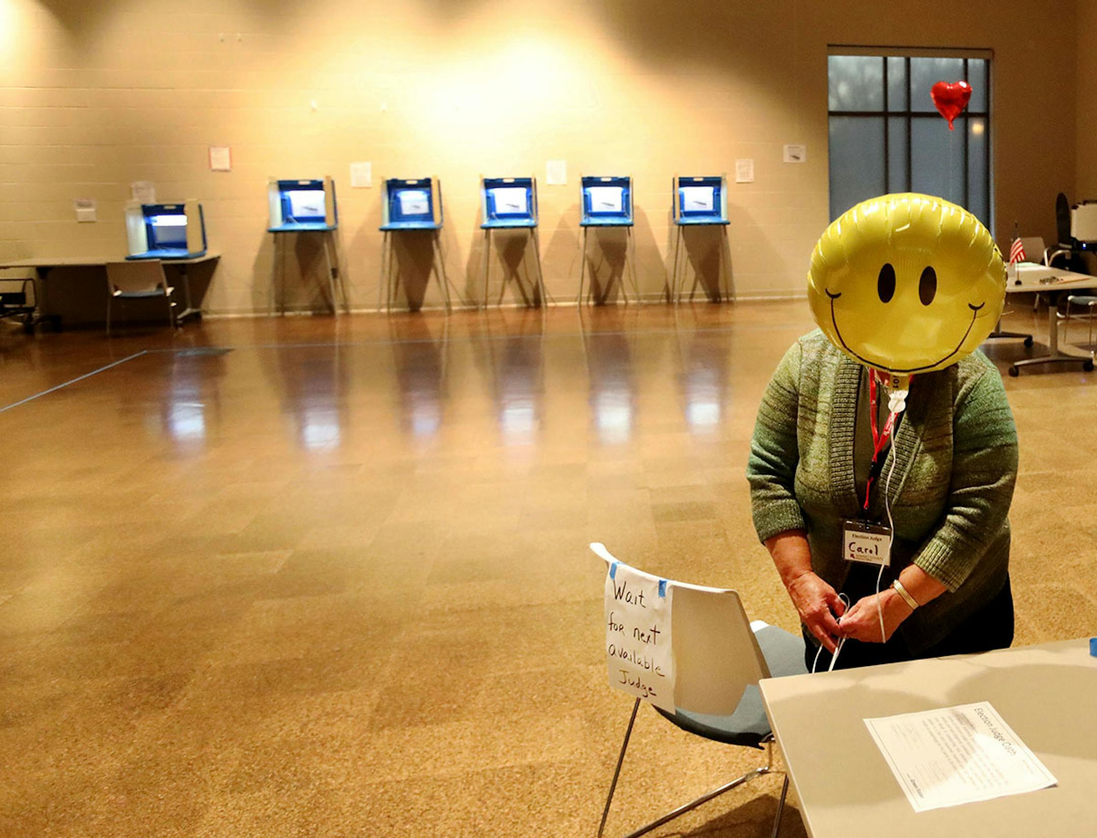 Election judge Carol Johnson tied a balloon to a chair before election day polls opened on Tuesday, Nov. 5, 2019, at the Arlington Hills Community Center in St. Paul.