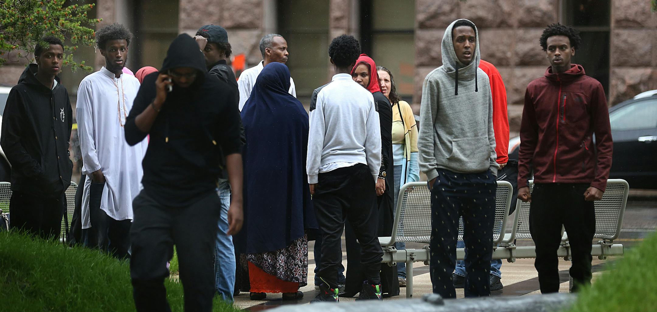 Some people who left the Federal Courthouse after a verdict was read in the ISIL case lingered. ] JIM GEHRZ ï james.gehrz@startribune.com / Minneapolis, MN / June 3, 2016 10:00 AM ñ BACKGROUND INFORMATION: Verdict in the ISIL case. Main story by Stephen Montemayor and David Chanen with the verdict, response from lawyers, reaction from families, the courthouse scene. With: RECRUIT.reax: Community reaction. JANY, 30'' RECRUIT.national: The trial's wider significance. MARCOTTY, 20'' RECRU