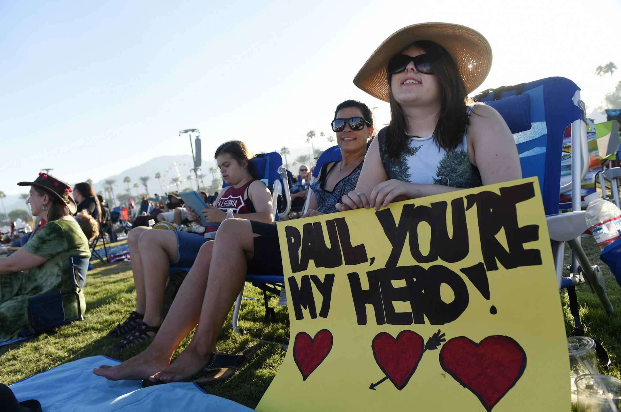 Abby Cooper, 17, of Irvine, Calif. waits for Paul McCartney's set on day 2 of the 2016 Desert Trip music festival at Empire Polo Field on Saturday, Oct. 8, 2016, in Indio, Calif.