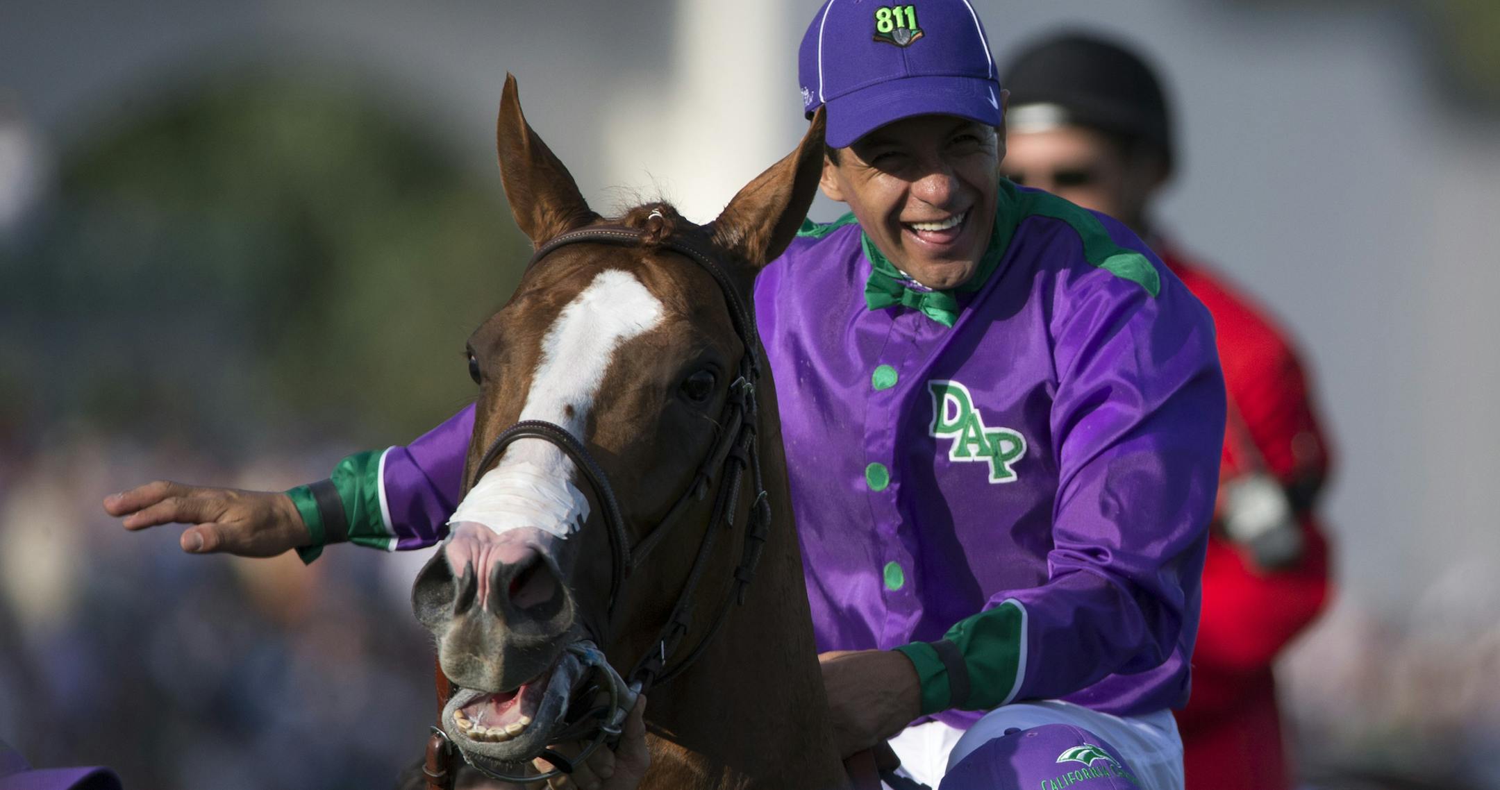Jockey Victor Espinoza celebrates after California Chrome won the Kentucky Derby, at Churchill Downs in Louisville, Ky., May 3, 2014. Chrome became the first horse from California to win the Derby since 1962, with Commanding Curve in second and Danza third. (Jabin Botsford/The New York Times)
