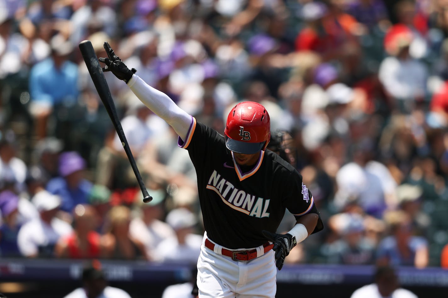 Jose Barrero, of the National League, starts to run after hitting a home run during the first inning of the MLB All Star Futures baseball game, Sunday, July 11, 2021, in Denver. (AP Photo/Gabe Christus)