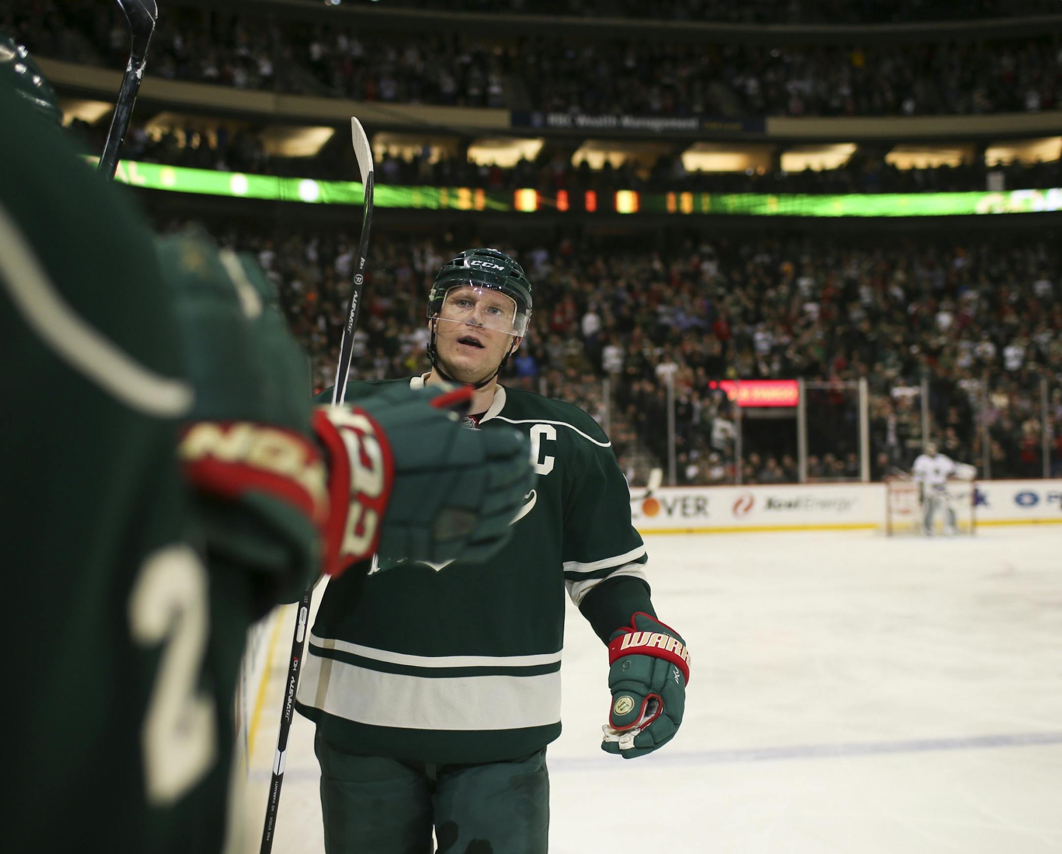 Wild center Mikko Koivu (9) celebrated his second period goal with the Wild bench Tuesday night.