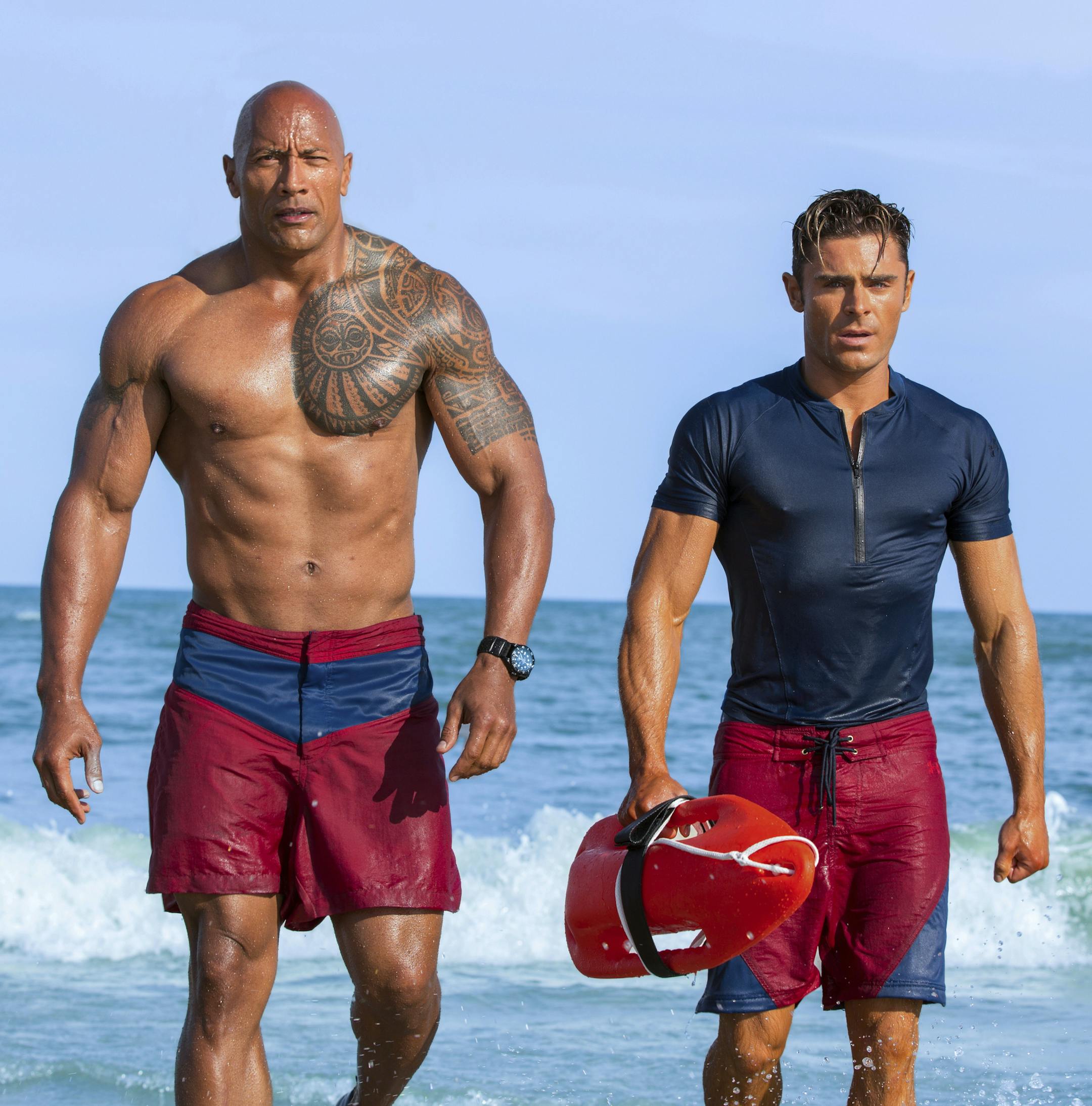 This image released by Paramount Pictures shows Dwayne Johnson as Mitch Buchannon, left, and Zac Efron as Matt Brody in "Baywatch." (Frank Masi/Paramount Pictures via AP)