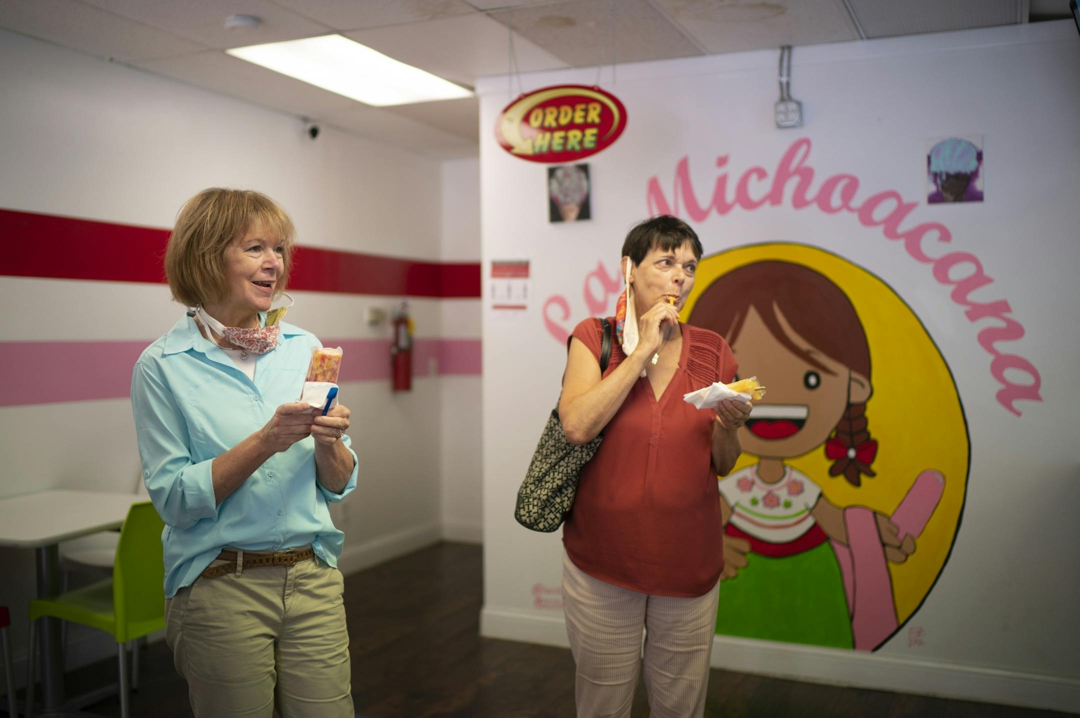 U.S. Sen. Tina Smith, left, and State Senator Sandy Pappas, both sampled ice cream from La Michoacana, a small shop on their walking tour of businesses on Cesar Chavez St. on St. Paul's West Side Tuesday afternoon.