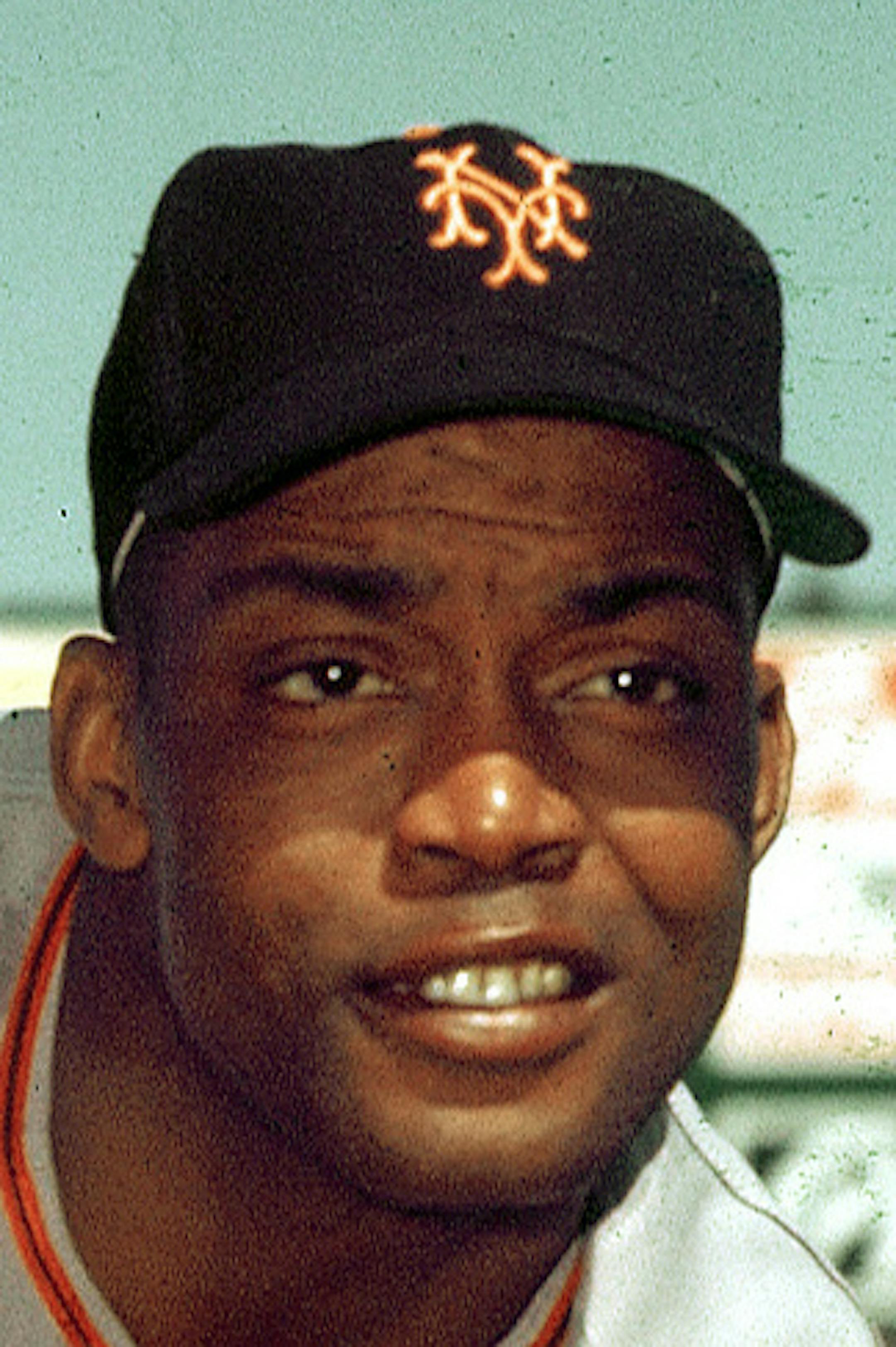 FILE- In this 1952, file photo, San Francisco Giants infielder Monte Irvin poses during spring training. Irvin, a Hall of Fame power-hitting outfielder who starred for the New York Giants in the 1950s in a career abbreviated by major league baseball's exclusion of black players Monday night, Jan. 11, 2016, of natural causes at his Houston home. He was 96. (AP Photo/File)