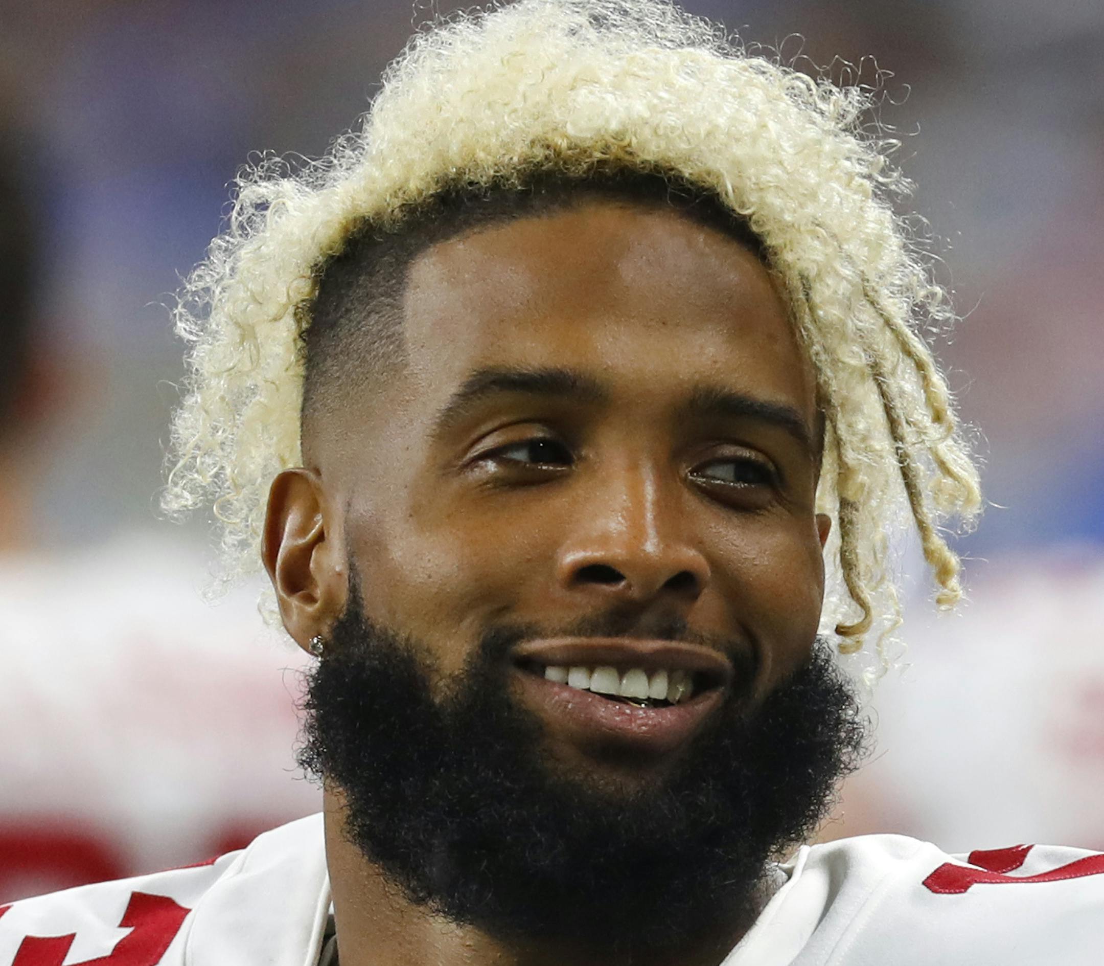 New York Giants wide receiver Odell Beckham smiles on the sidelines during the first half of an NFL football game against the Detroit Lions, Friday, Aug. 17, 2018, in Detroit. (AP Photo/Paul Sancya) ORG XMIT: DTF1