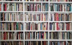 Re-shelving a library takes time, but there are unexpected rewards. (Christopher Knight/Los Angeles Times/TNS) ORG XMIT: 1614371