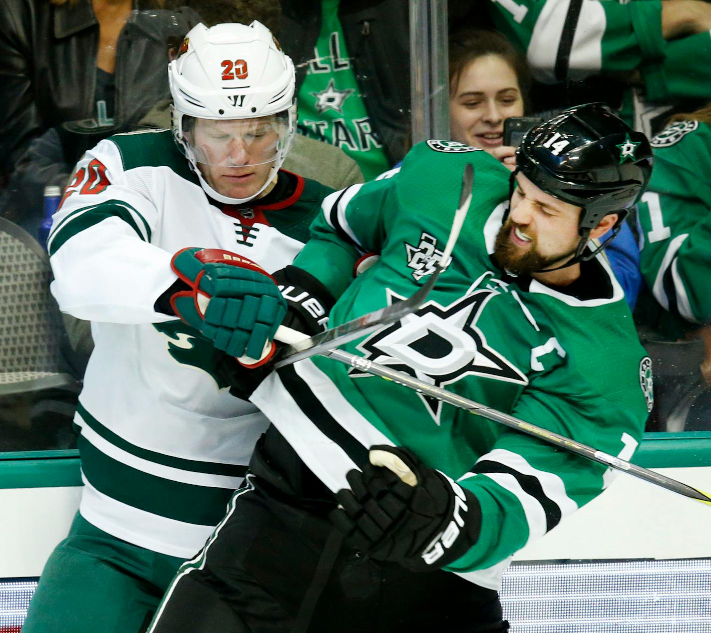 In a February 3, 2018, file image, the Dallas Stars' Jamie Benn (14) tries to break free from the Minnesota Wild's Ryan Suter (20) at the American Airlines Center in Dallas. The two teams met up again on Saturday, March 31, 2018, in Dallas, and the Stars came away with a 4-1 win, and Suter was injured late in the second period. (Tom Fox/Dallas Morning News/TNS) ORG XMIT: 1227448