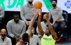 Minnesota Timberwolves forward Anthony Edwards (1) shoots over Houston Rockets center Justin Patton during the fourth quarter during an NBA basketball