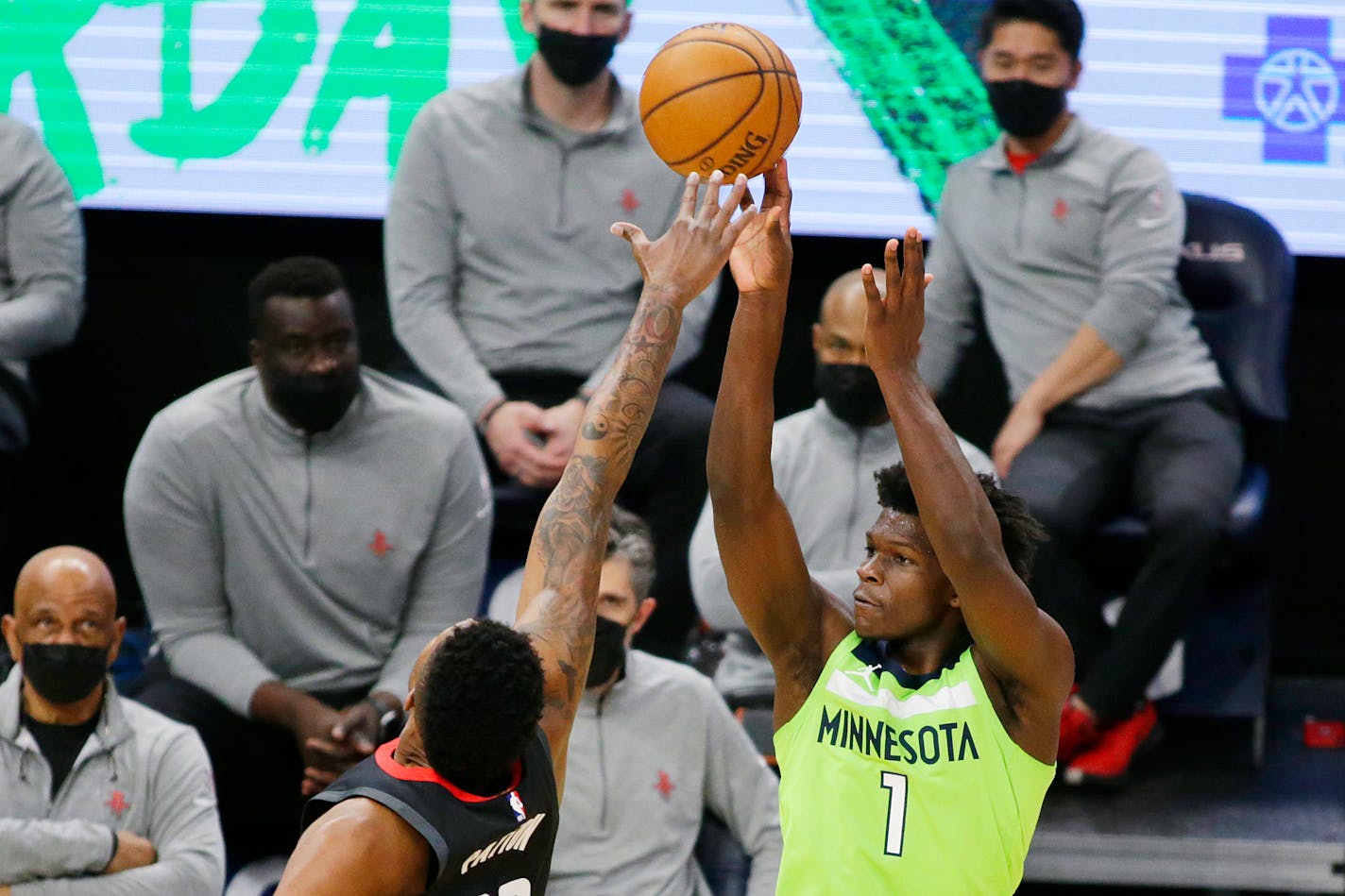 Minnesota Timberwolves forward Anthony Edwards (1) shoots over Houston Rockets center Justin Patton during the fourth quarter during an NBA basketball game Saturday, March 27, 2021, in Minneapolis. (AP Photo/Andy Clayton-King)