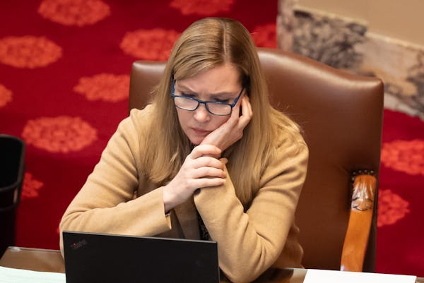 Sen. Nicole Mitchell, DFL-Woodbury, listened on April 30 as GOP members spoke in favor of the motion to call for her resignation on her second day bac