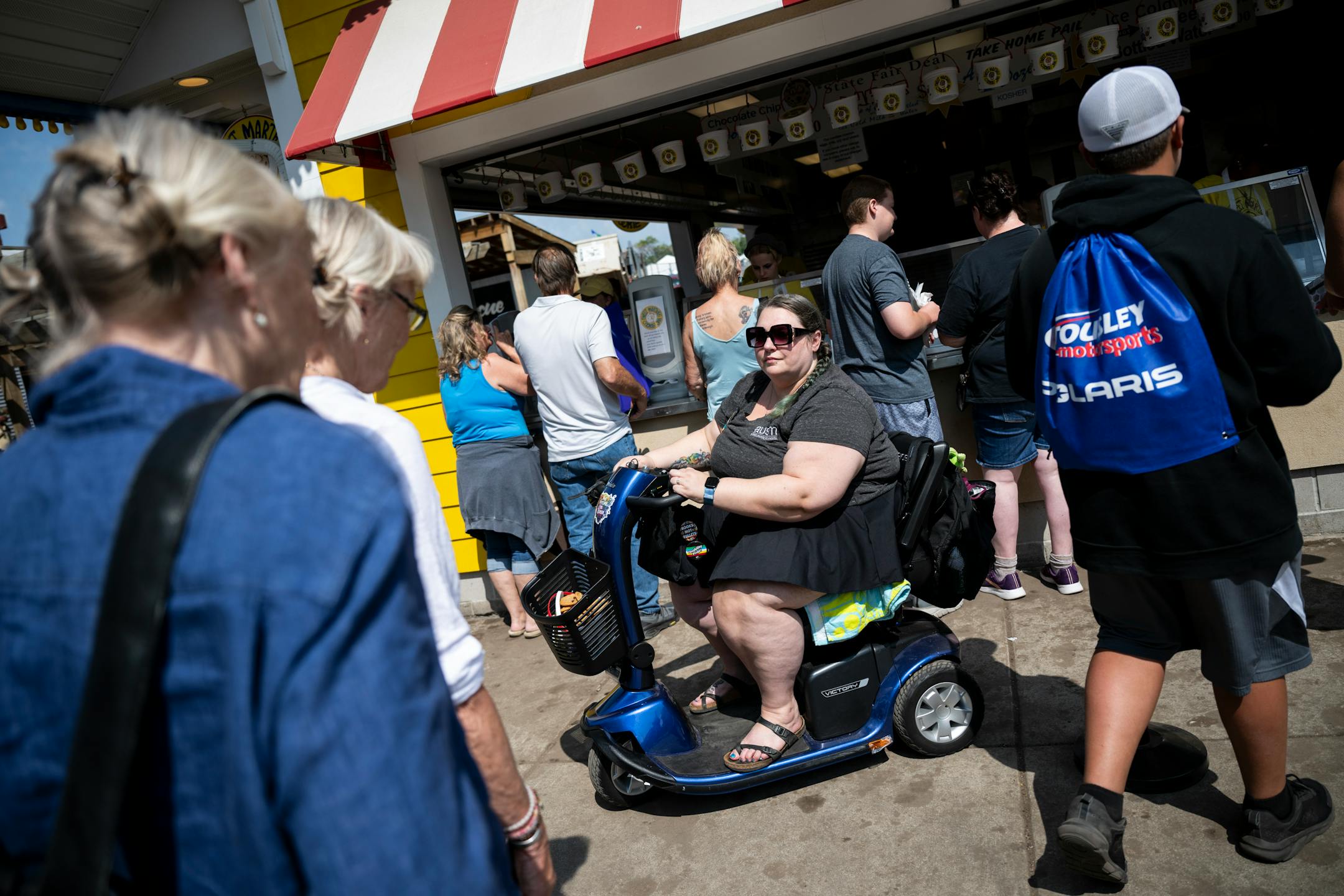 Jillian Nelson, a disability advocate with the Autism Society of Minnesota (AUSM), purchased a bucket of Sweet Martha's Cookies.