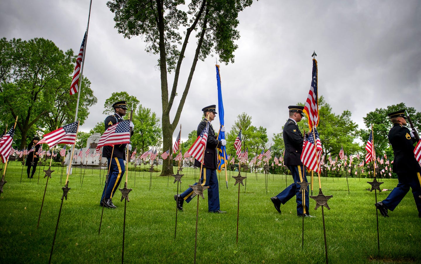 The 133rd National Guard Base Honor Guard retired the colors as the ceremony concluded. ] GLEN STUBBE * gstubbe@startribune.com , Monday, May 25, 2015 Traditional Memorial Day ceremony held near the Soldiers Memorial monument at Lakewood Cemetery, Minneapolis.