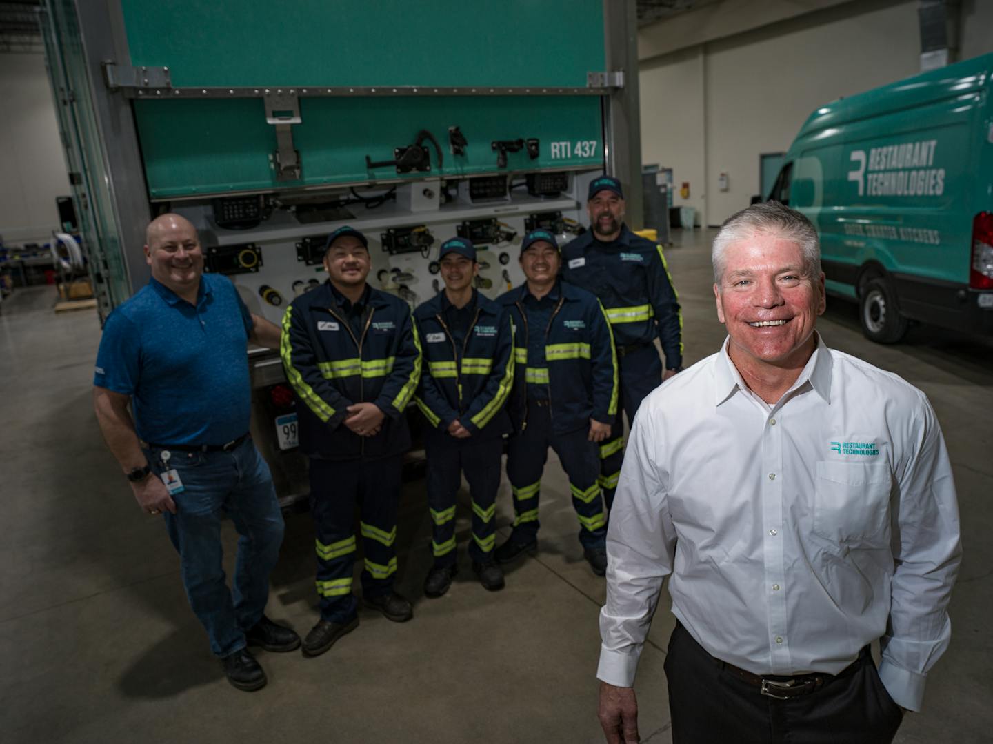 Restaurant Technologies CEO Jeff Keisel stands in front of depot employees who deliver and help clean 32,000 commercial kitchens nationally, and recycle the oil through biodiesel refiners in Mendota Heights, Minn. on Thursday, March 10, 2022. Twin Cities-based Restaurant Technologies, in the cooking-oil and renewable-fuel trades, has soared to $650 million in profitable sales, providing up to 300 million gallons of cooking-oil and related-services to restaurants that RTI recycles for renewable-biodiesel production. RICHARD TSONG-TAATARII • richard.tsong-taatarii@startribune.com