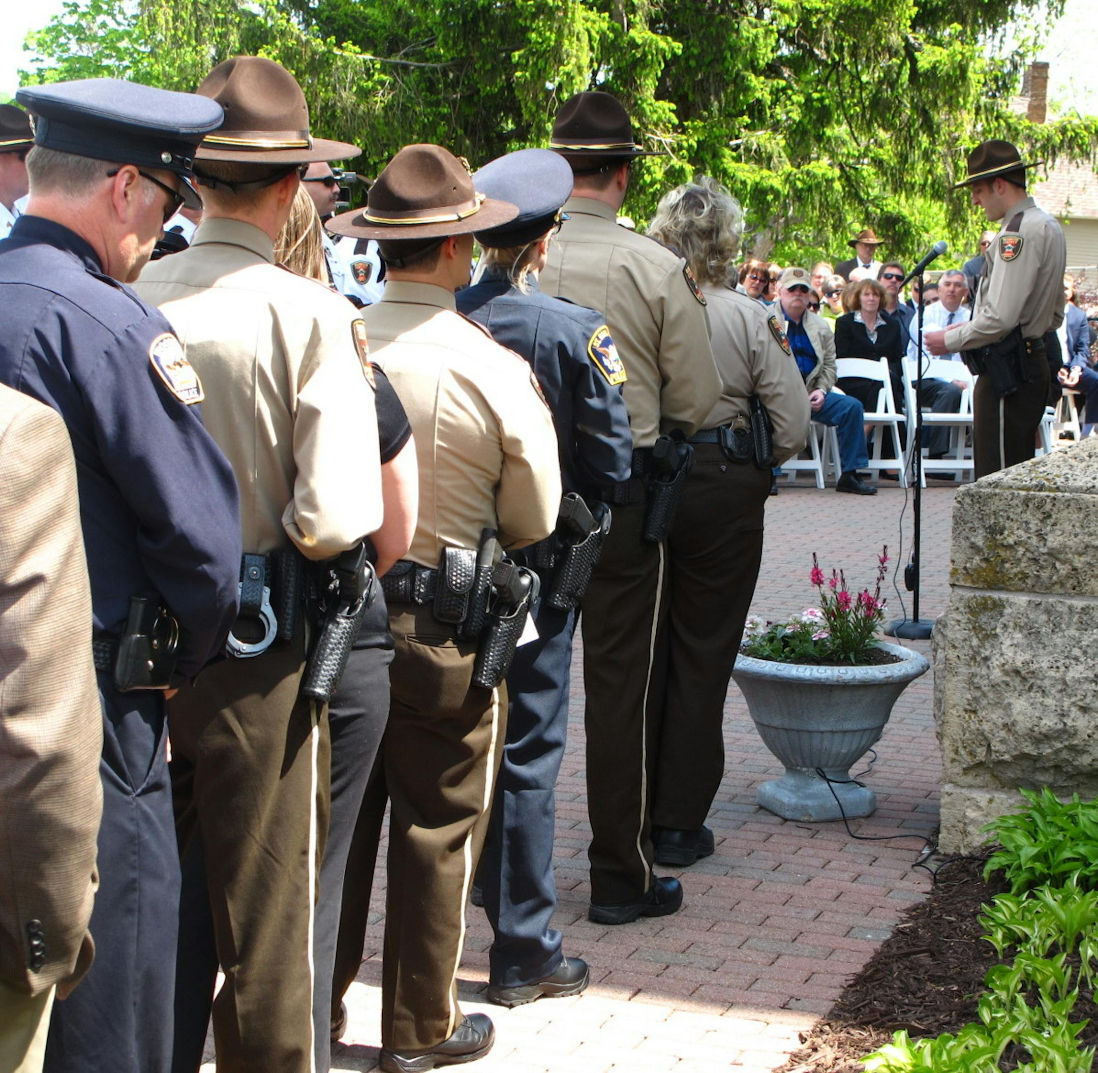 Law enforcement officers in Washington County waited their turn to read names of 128 men and women, nationwide, who died in 2015 in the line of duty. The event took place at Historic Courthouse in Stillwater.
