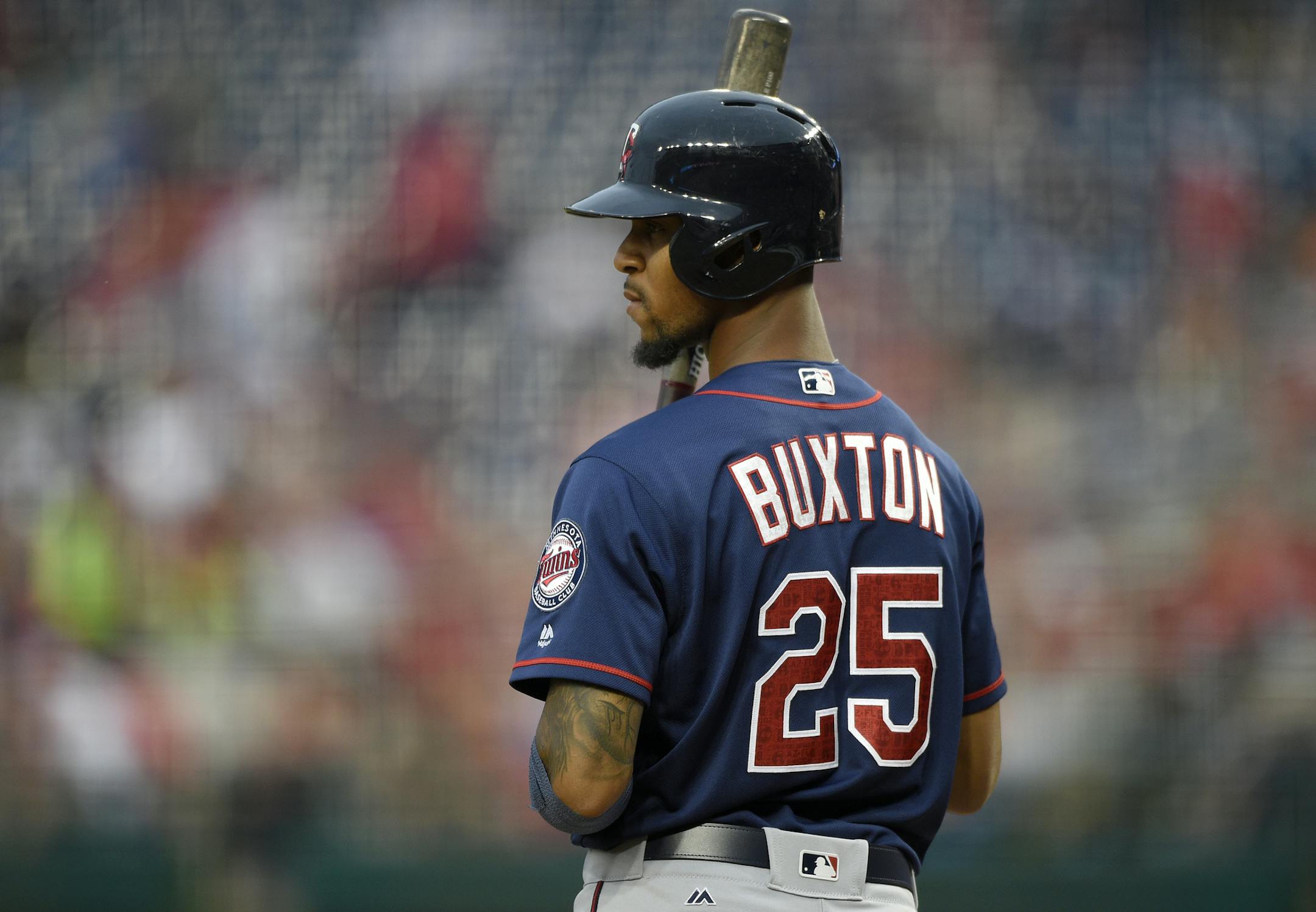 Minnesota Twins' Byron Buxton (25) looks on during the third inning of an interleague exhibition baseball game against the Washington Nationals, Friday, April 1, 2016, in Washington. The Nationals won 4-3. (AP Photo/Nick Wass) ORG XMIT: OTKNY