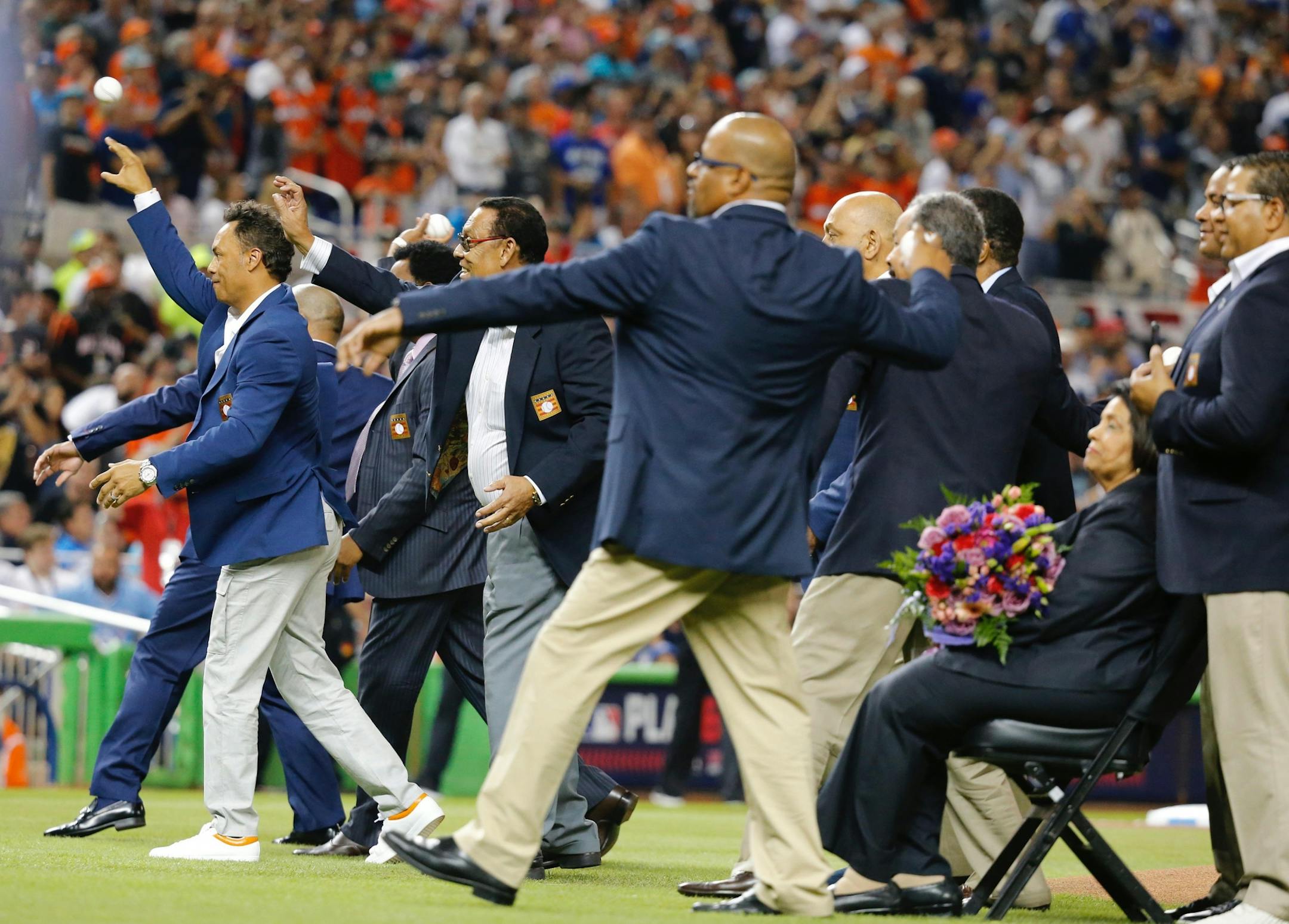 Latin baseball Hall of Fame players throw out the first pitch prior to the start of the MLB All-Star Game on Tuesday, July 11, 2017, at Marlins Park in Miami, Fla.