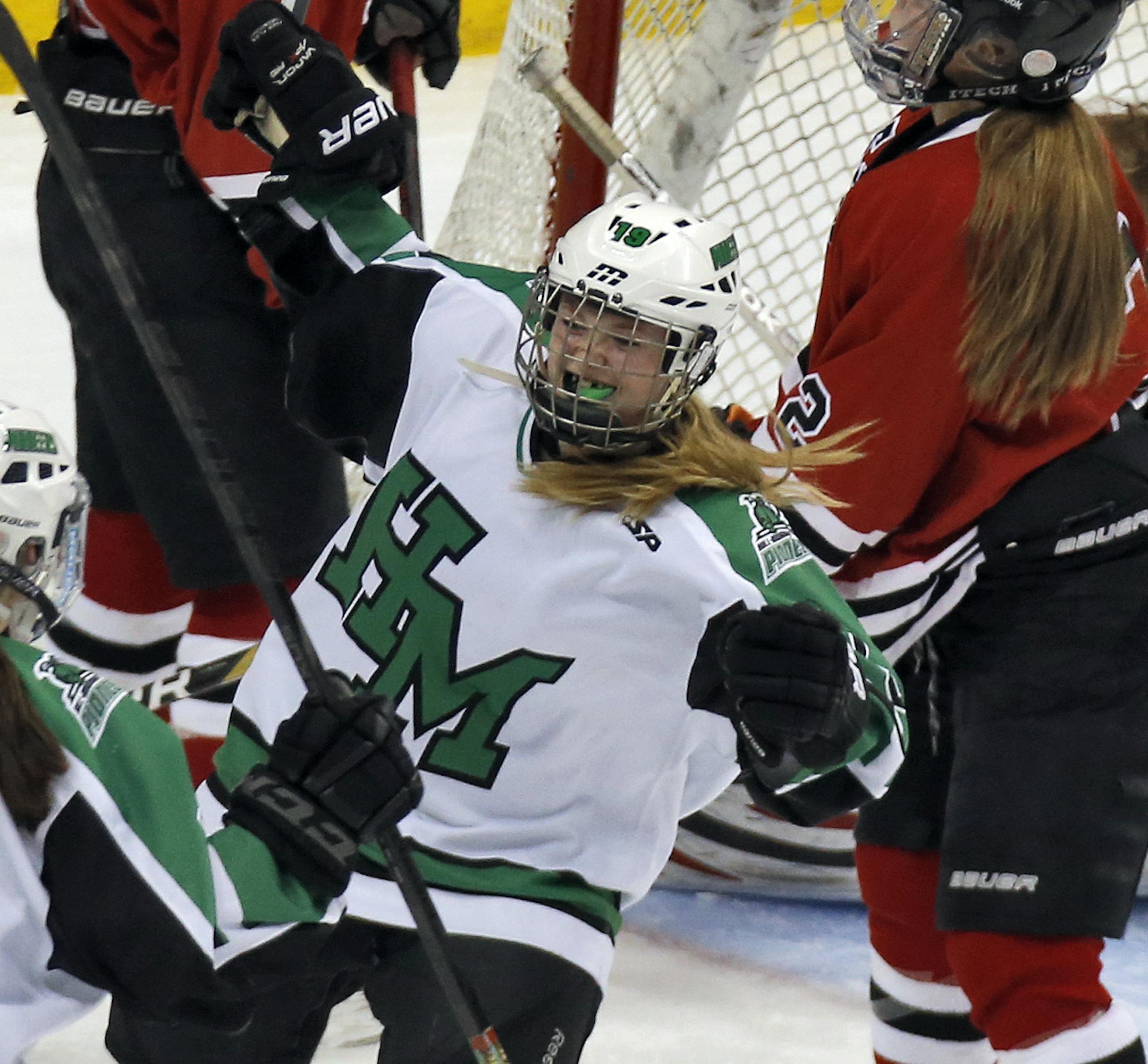 Girls Class 2A State Hockey Semifinals - Hill-Murray Pioneers vs. Eden Prairie Eagles. Hill-Murray won 1-0. Pioneers Kenzie Prater (face to camera) celebrated after scoring the winning and only goal of the game. (MARLIN LEVISON/STARTRIBUNE(mlevison@startribune.com)