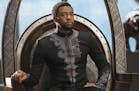This image released by Disney shows Chadwick Boseman in a scene from Marvel Studios' "Black Panther." Just as &#xec;Black Panther&#xee; is setting rec