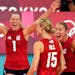United States' Micha Hancock celebrates with teammates winning the women's volleyball preliminary round pool B match between United States and Italy a
